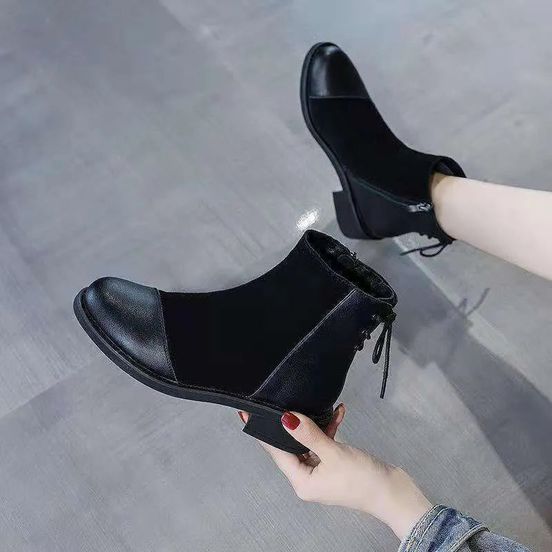 Women's black knee-high Martin boots with side zip, round toe, bow detail, and non-slip rubber sole