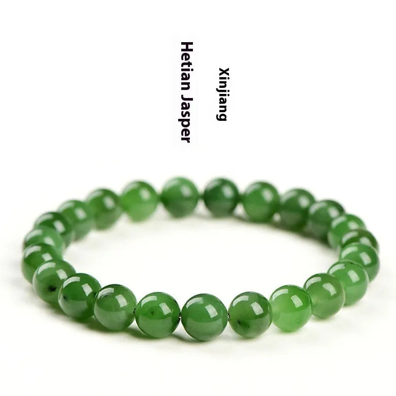 Polished natural Jasper Hetian jade bead bracelet on wrist, showing bead detail.