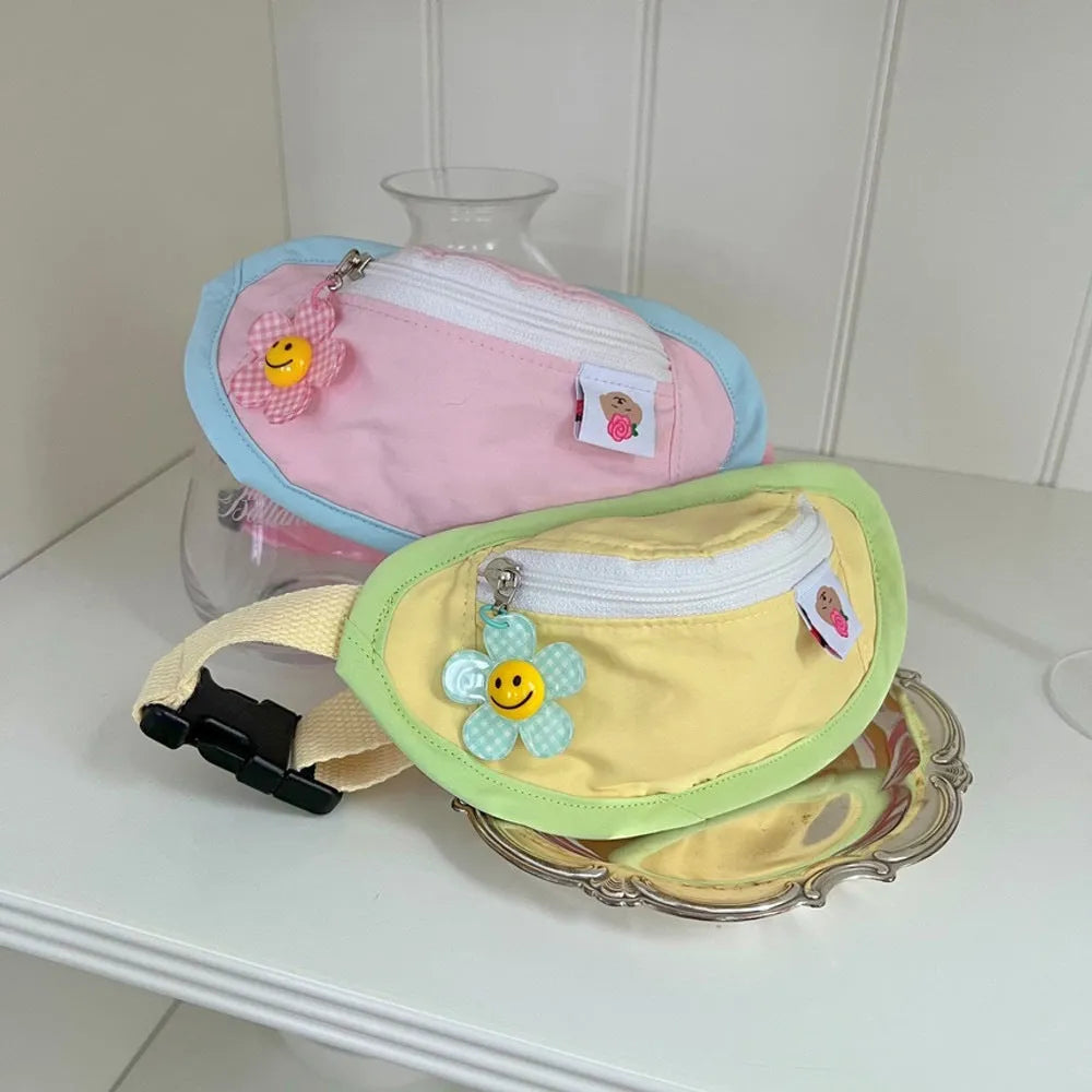 Powder blue backpack-style dog poop bag dispenser clipped to a harness.