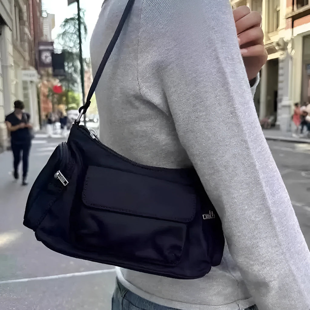 Black women's shoulder bag with side line detailing and double pockets