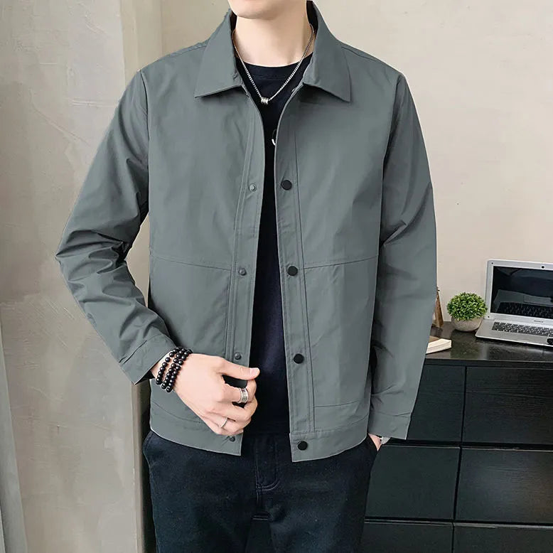 Man wearing a Korean style thin single-layer polyester jacket in light gray.