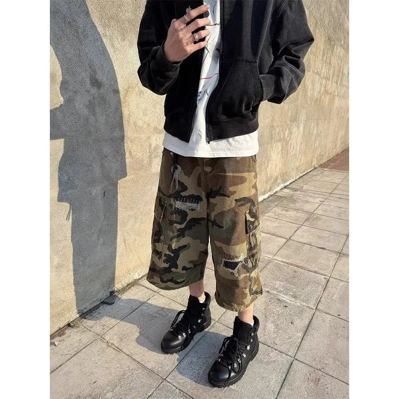 Men's camouflage cropped jeans with retro patches and ripped detailing in straight leg cut