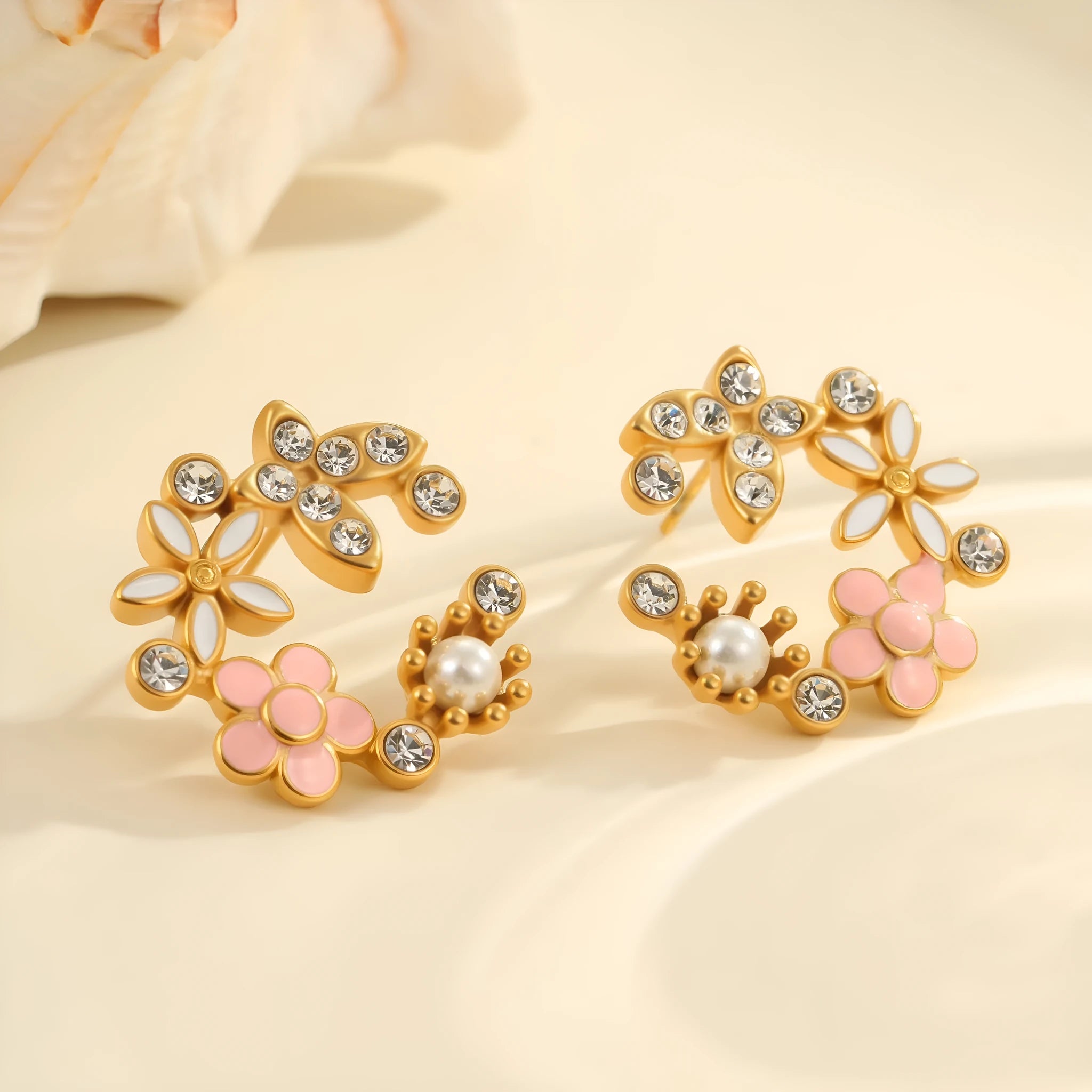 Women's floral stud earrings with petal design in electroplated finish on stainless steel