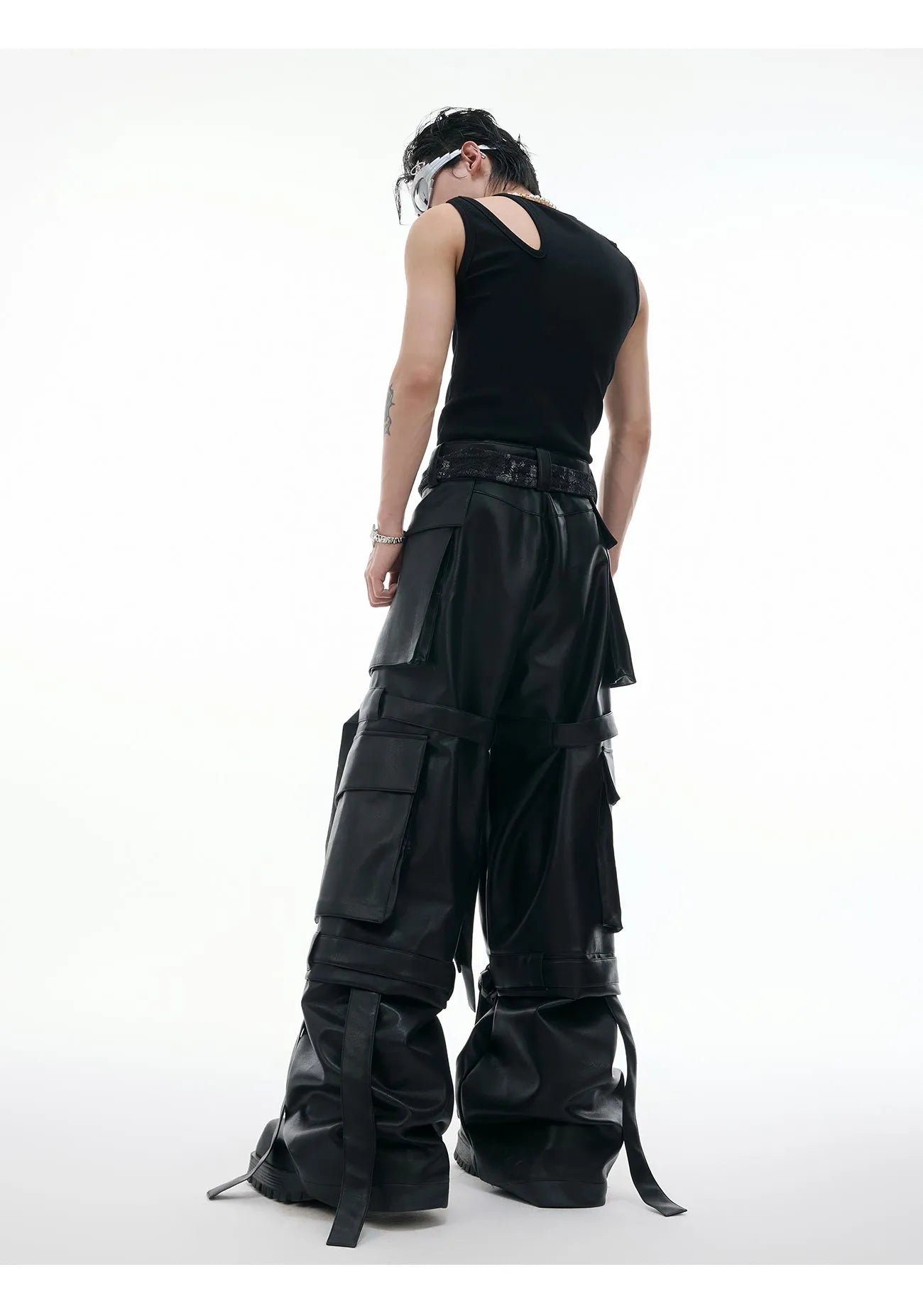 Men's black loose-fit quilted trousers with multiple pockets and heavy stitching