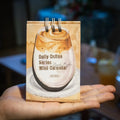 Mini 2025 desk calendar in a simple modern design on a wooden desk