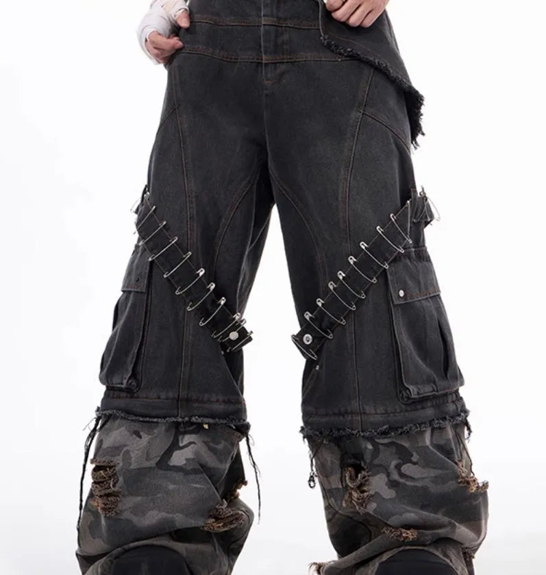 Men's grey camouflage jeans with splicing panel design and decorative pin and ribbon details