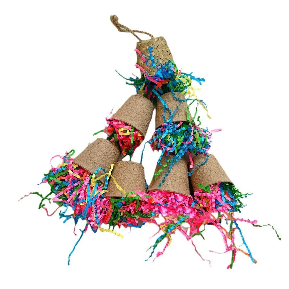 Parrot chew toy with woven palm fibres and a paper cup, hanging 38 cm long in a natural wood colour.