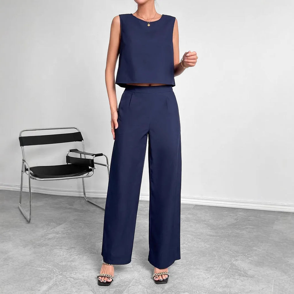 Red polyester two-piece women's set with sleeveless top and wide-leg trousers