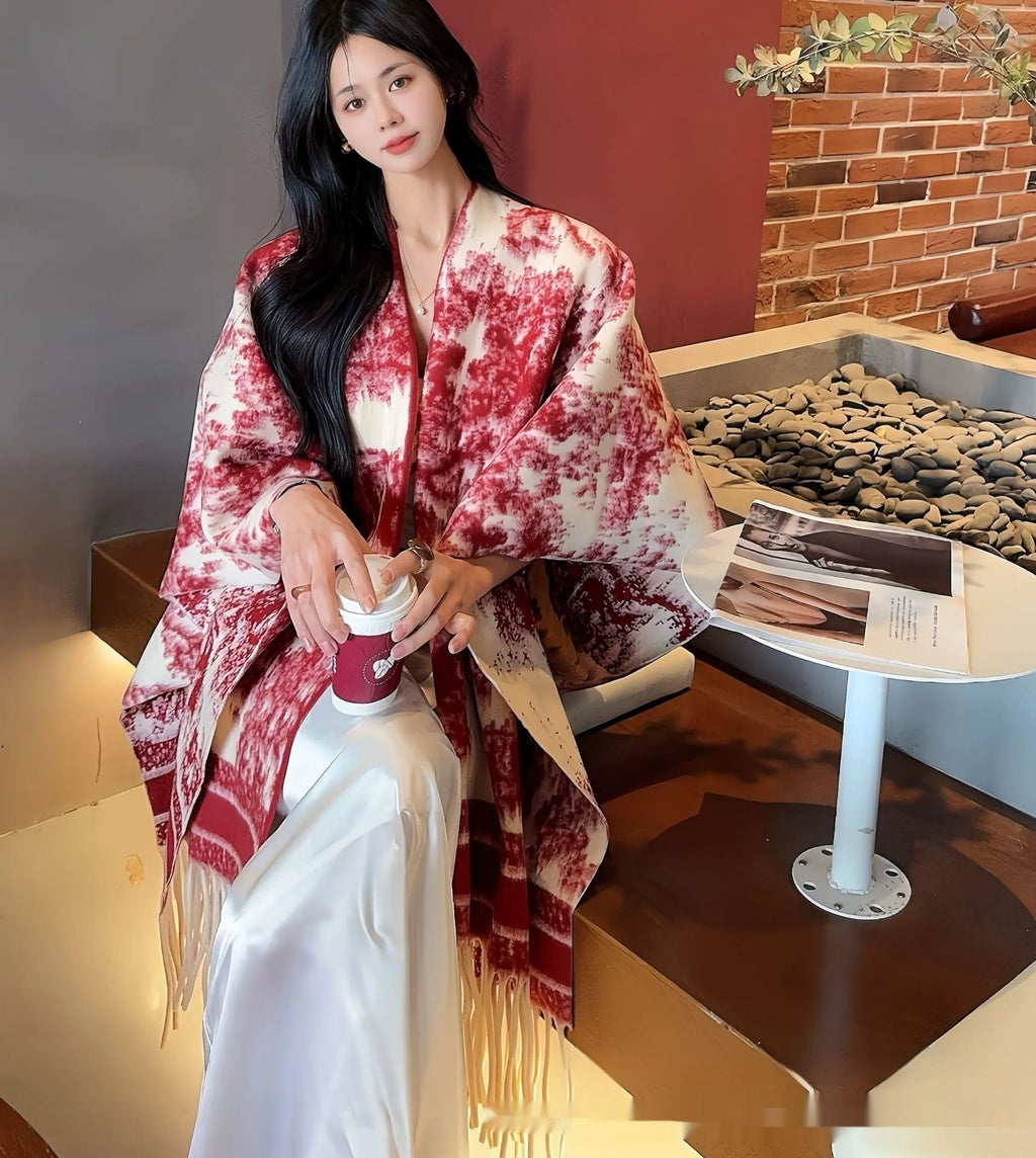 Women's polyester scarf cape with tassel edges in shawl style, shown in one of five available colours
