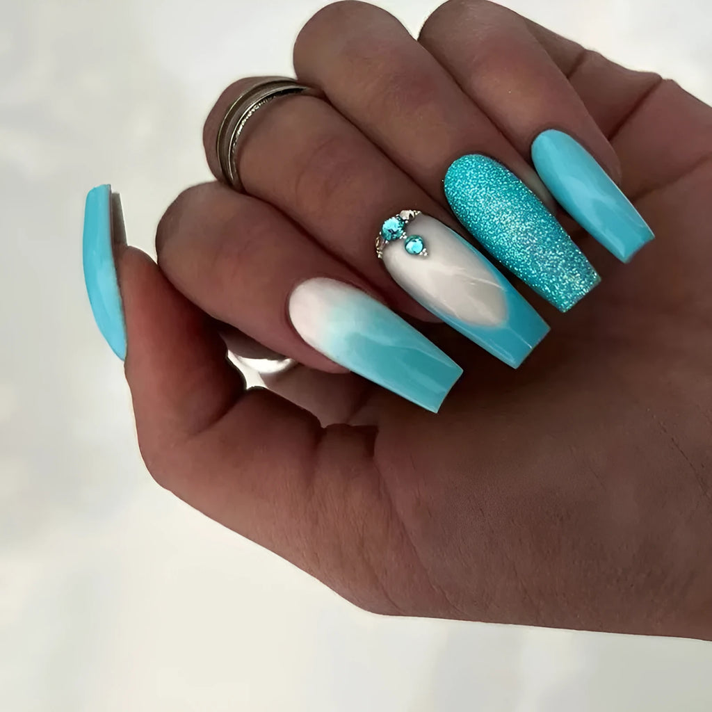 Smart blue diamond press-on nails with long ballet shape and debris pattern