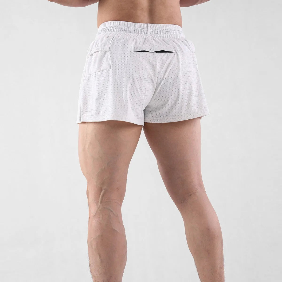 Men's black nylon quick-drying summer shorts laid flat, showing mid-waist and shorts length design.