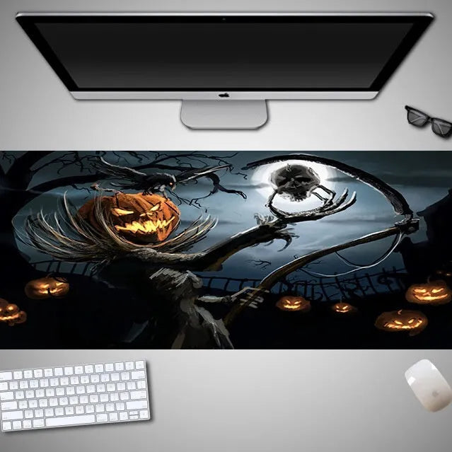 Large Halloween-themed computer mouse pad with graphic design on a desk