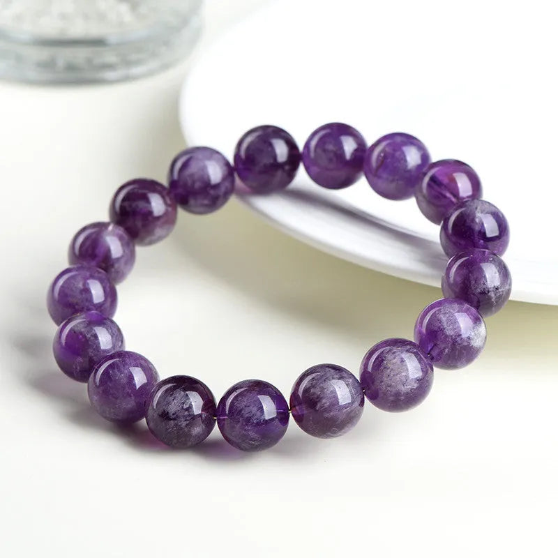 Natural feather amethyst snow mountain purple bracelet with geometric beads featuring the Ruyi symbol.