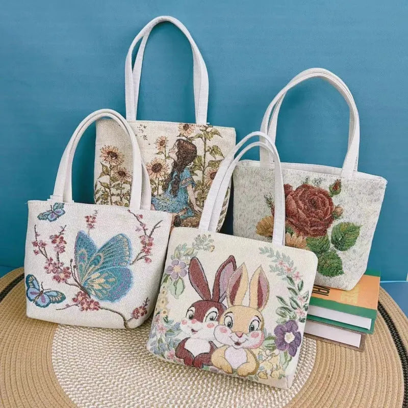 Double-sided gold wire embroidered canvas tote bag in small, medium, and large sizes with floral patterns.