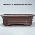 Handmade purple sand antique rectangular flower pot on a desktop.