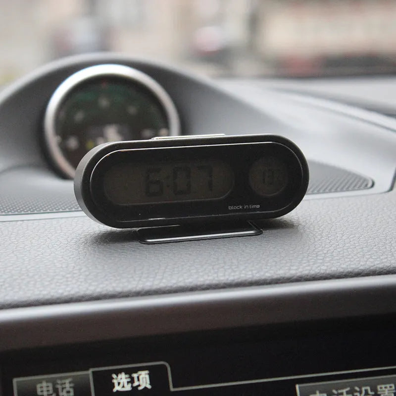Black car electronic clock and thermometer with LED display on adjustable dashboard bracket