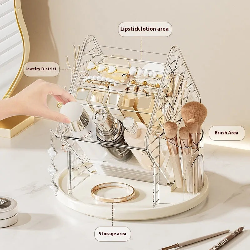 Rotating multi-tiered cosmetics storage box in clear transparent plastic on a wooden surface.