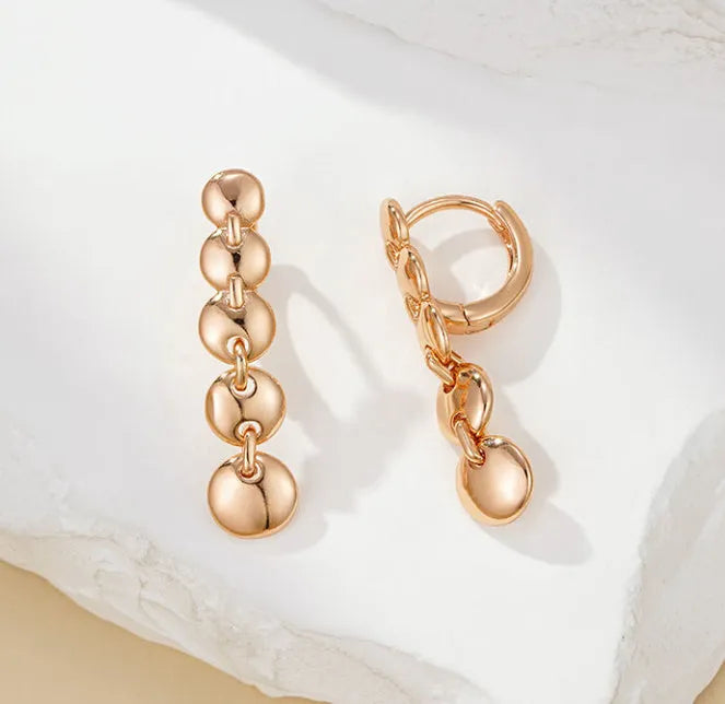Gold retro woven hoop earrings showing full circle and textured copper surface