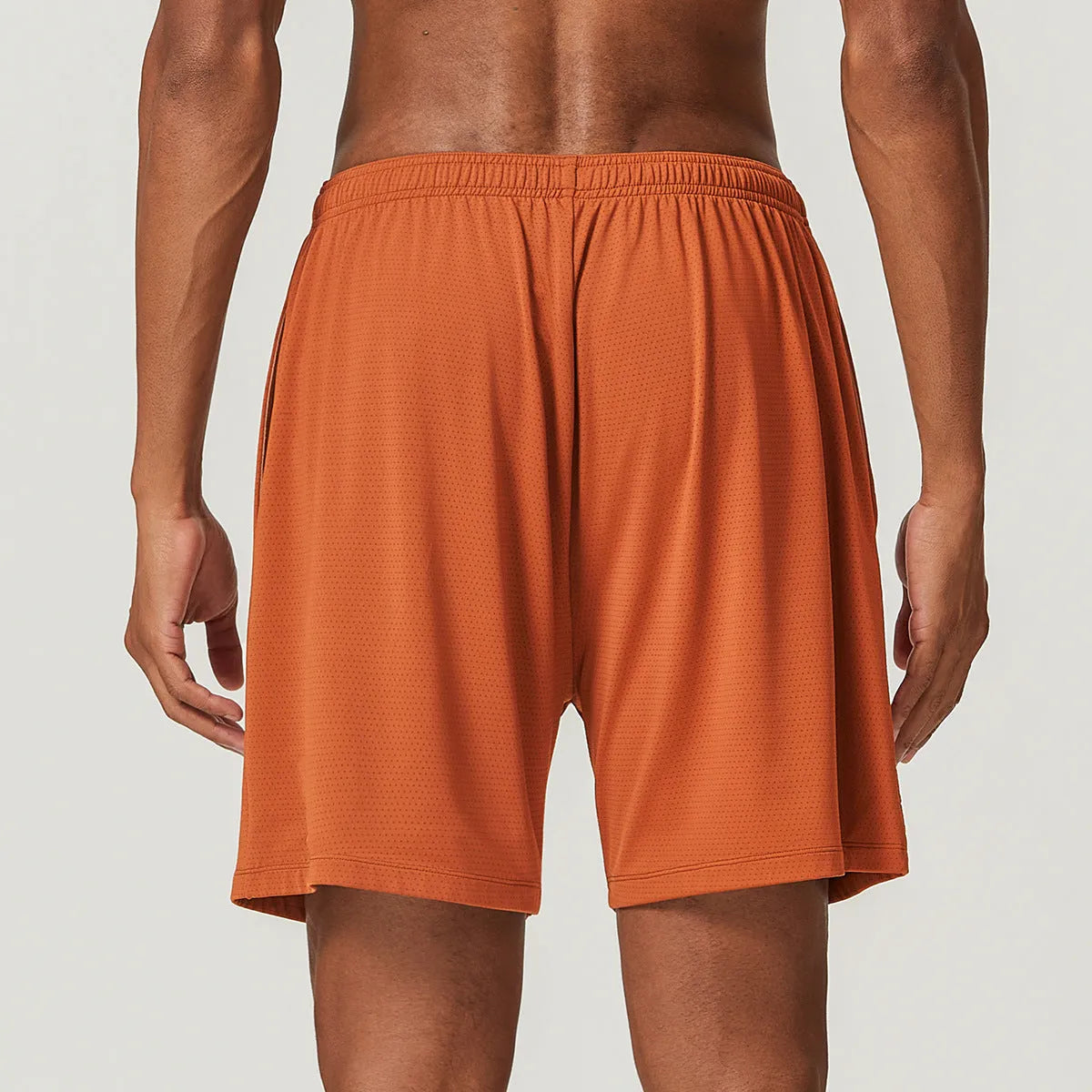 Men's quick-dry double-layer running shorts in various colours on a neutral background.