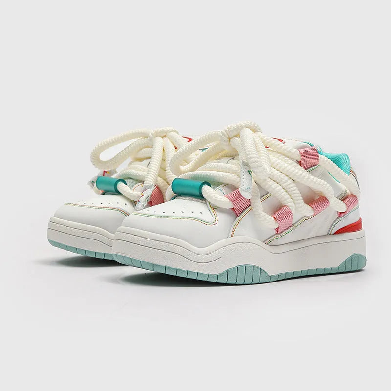 Low-top unisex casual shoes in denim blue with white rubber sole and lace-up front.