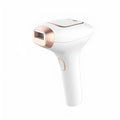 Pink and white three-in-one ice-sensing laser hair removal device with shaver attachment and safety glasses