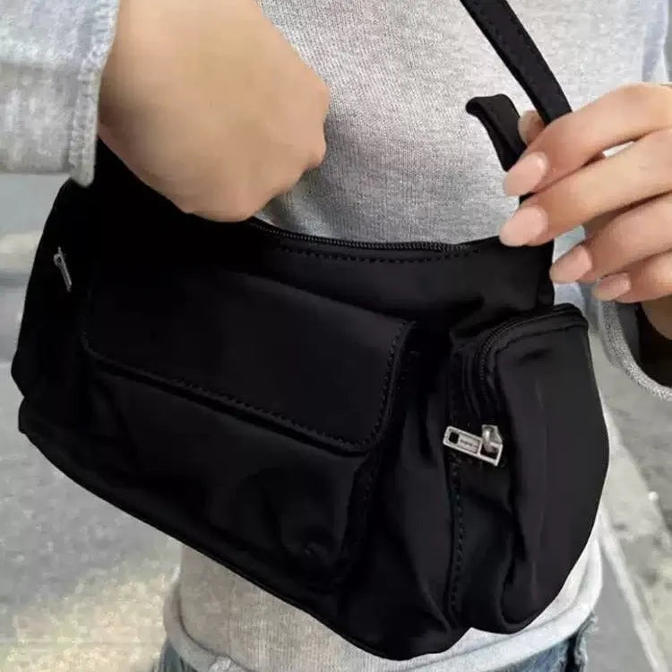 Black women's shoulder bag with side line detailing and double pockets