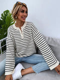 Black striped women's loose top with drop shoulders and button detail on viscose knit fabric