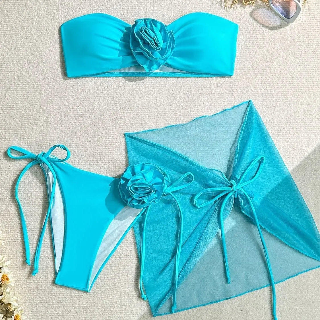 Women's pink swimsuit tube top with three-dimensional flower tie design and matching skirt