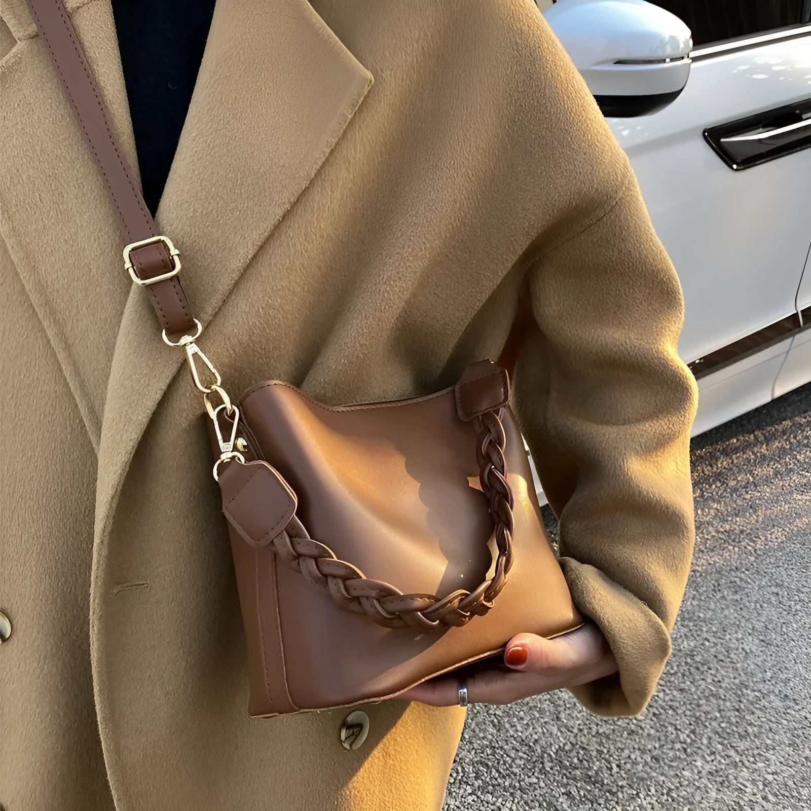 Retro woven PU leather crossbody bucket bag in khaki colour showing underarm design and textured surface