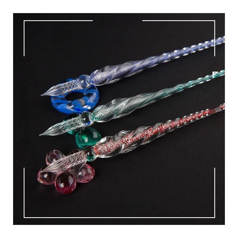 Transparent glass signature pen with coloured ink visible inside, abstract modelling, gift box packaging