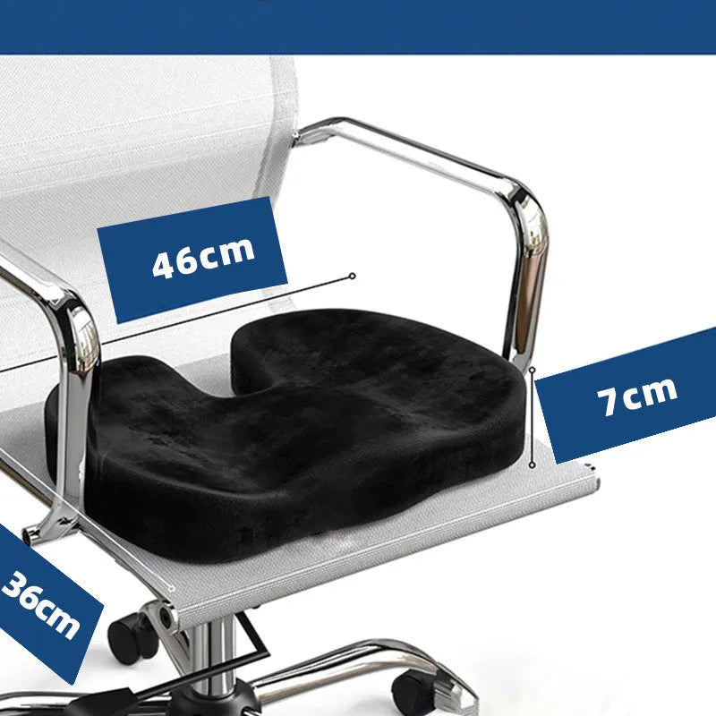 Black U-shaped memory foam seat cushion with flannel cover, shown on an office chair.