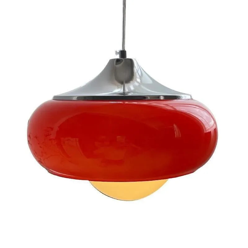 Three-headed Bauhaus pendant light with milky white glass egg tart shades hanging from a ceiling.