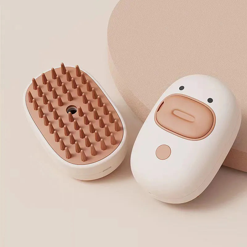 White rechargeable steam pet brush with rubber comb teeth and water tank for grooming dogs and cats.