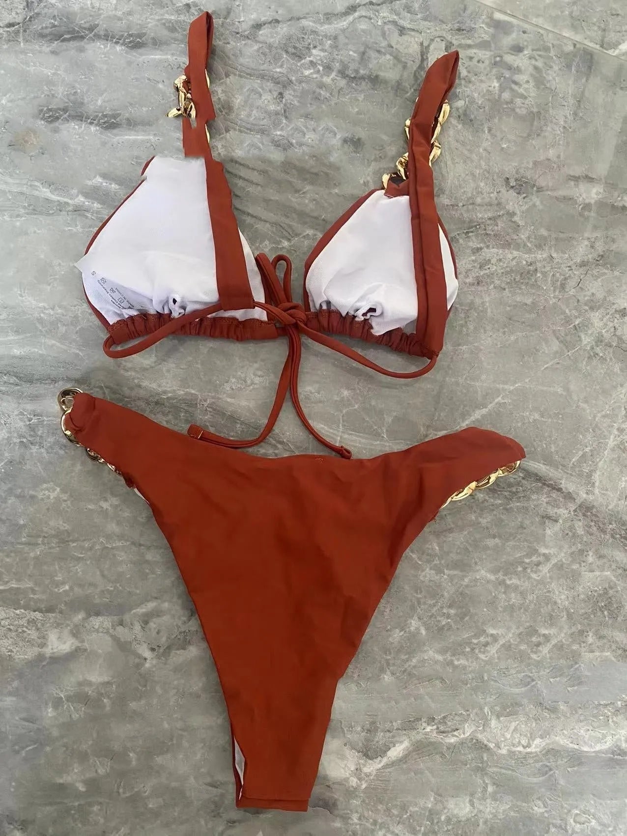 Brown women's tube top bikini swimsuit with push-up design and ring tether detail.