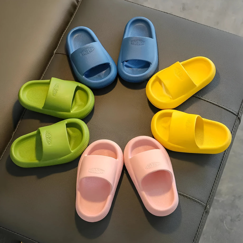 Children's brightly coloured EVA slippers with a thick, non-slip sole.