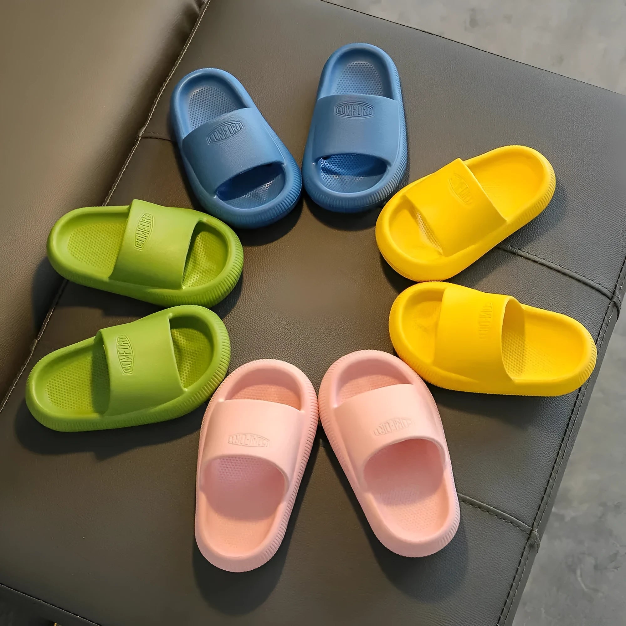 Children's brightly coloured EVA slippers with a thick, non-slip sole.