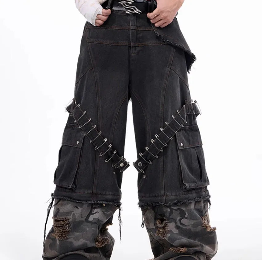 Men's grey camouflage jeans with splicing panel design and decorative pin and ribbon details