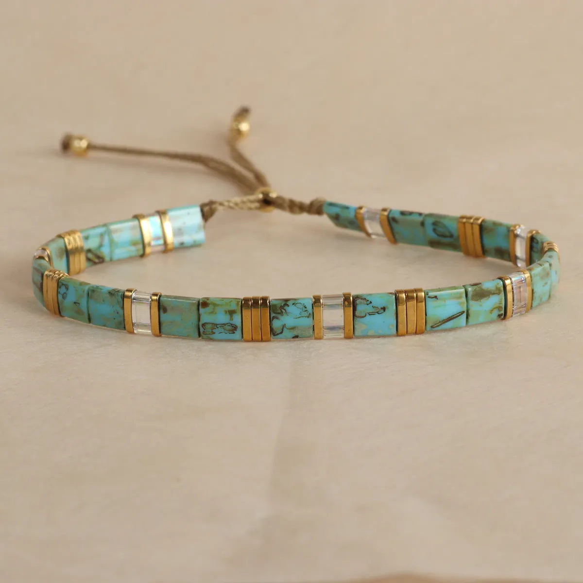 Geometric glass and coloured glaze bead bracelet in milky white, black, green, blue, or red