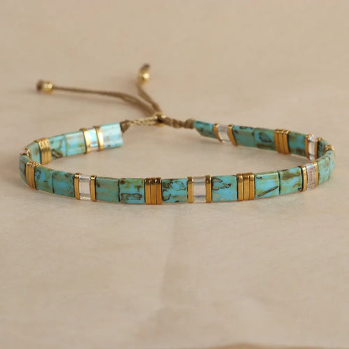 Geometric glass and coloured glaze bead bracelet in milky white, black, green, blue, or red