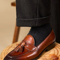 Men's black genuine leather tassel loafers with a rubber sole