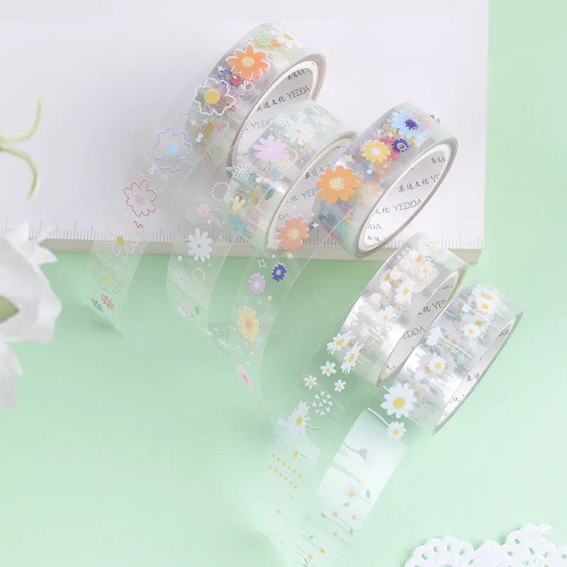 Five rolls of transparent adhesive tape with Midsummer Daisy cartoon decoration on a clear background.