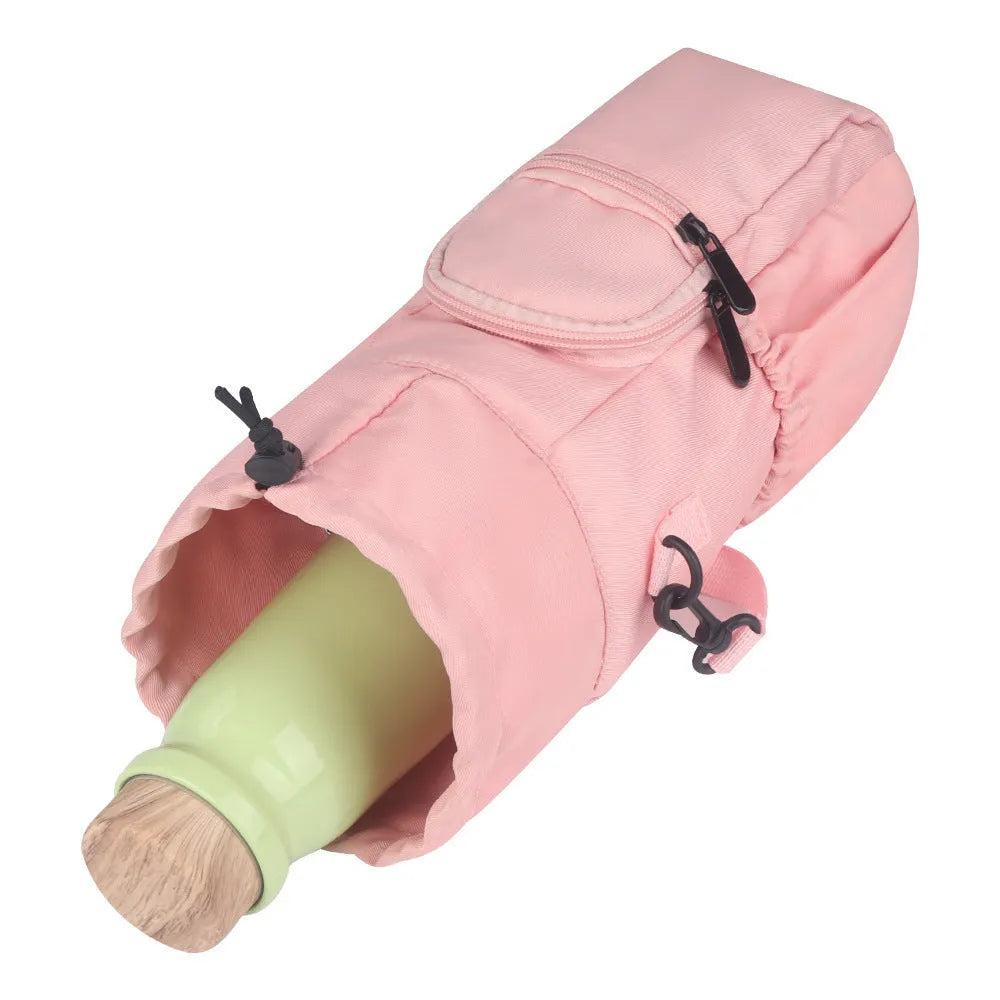Black cloth water bottle pouch with crossbody strap and side handle on a model.