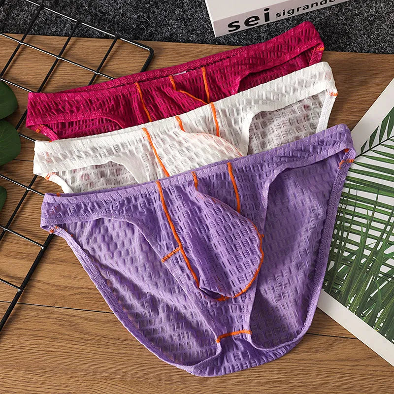 Men's white ice silk lace low waist briefs laid flat, showing the solid colour and lace fabric texture.