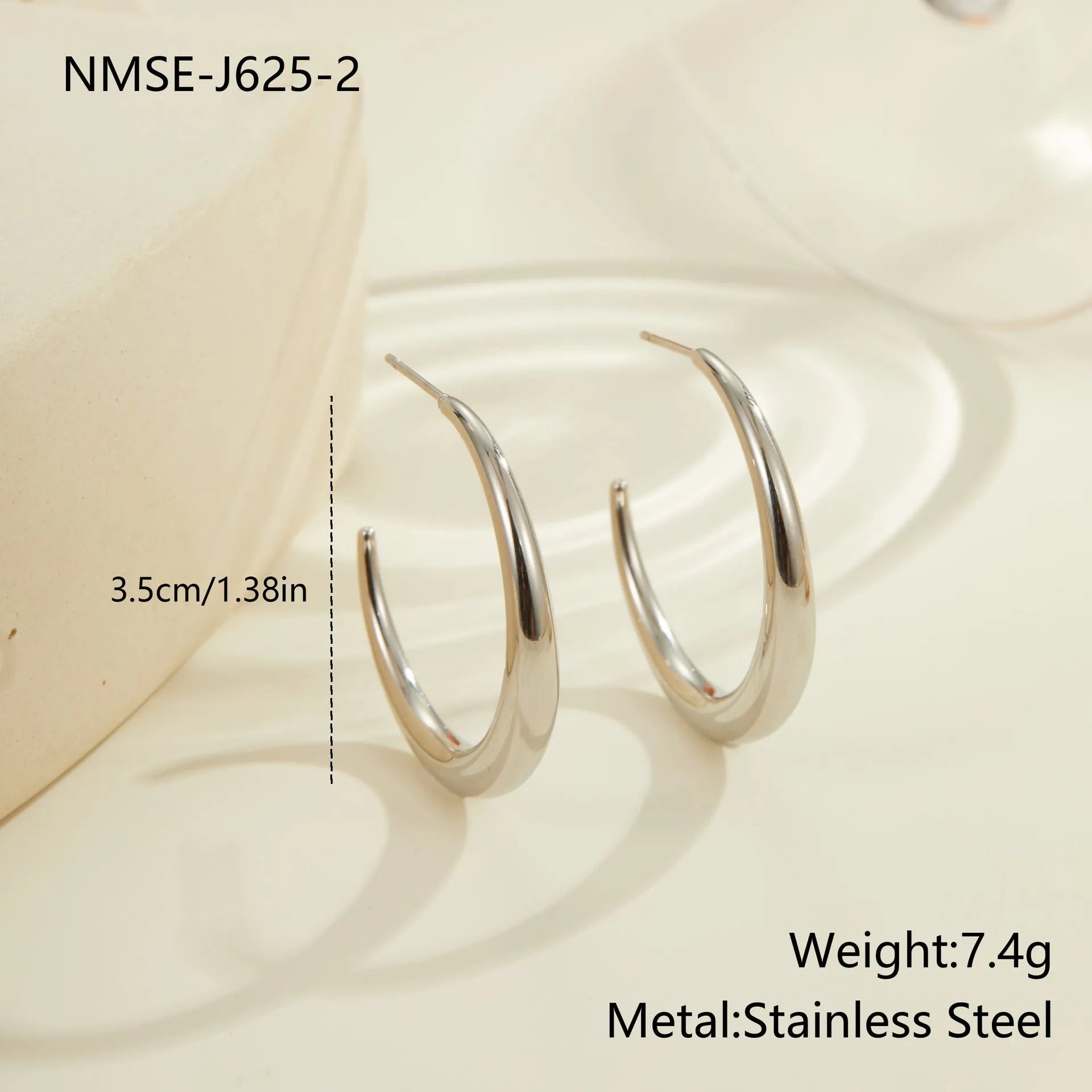 Geometric round stainless steel hoop earrings with gold plating, shown in large and small sizes.