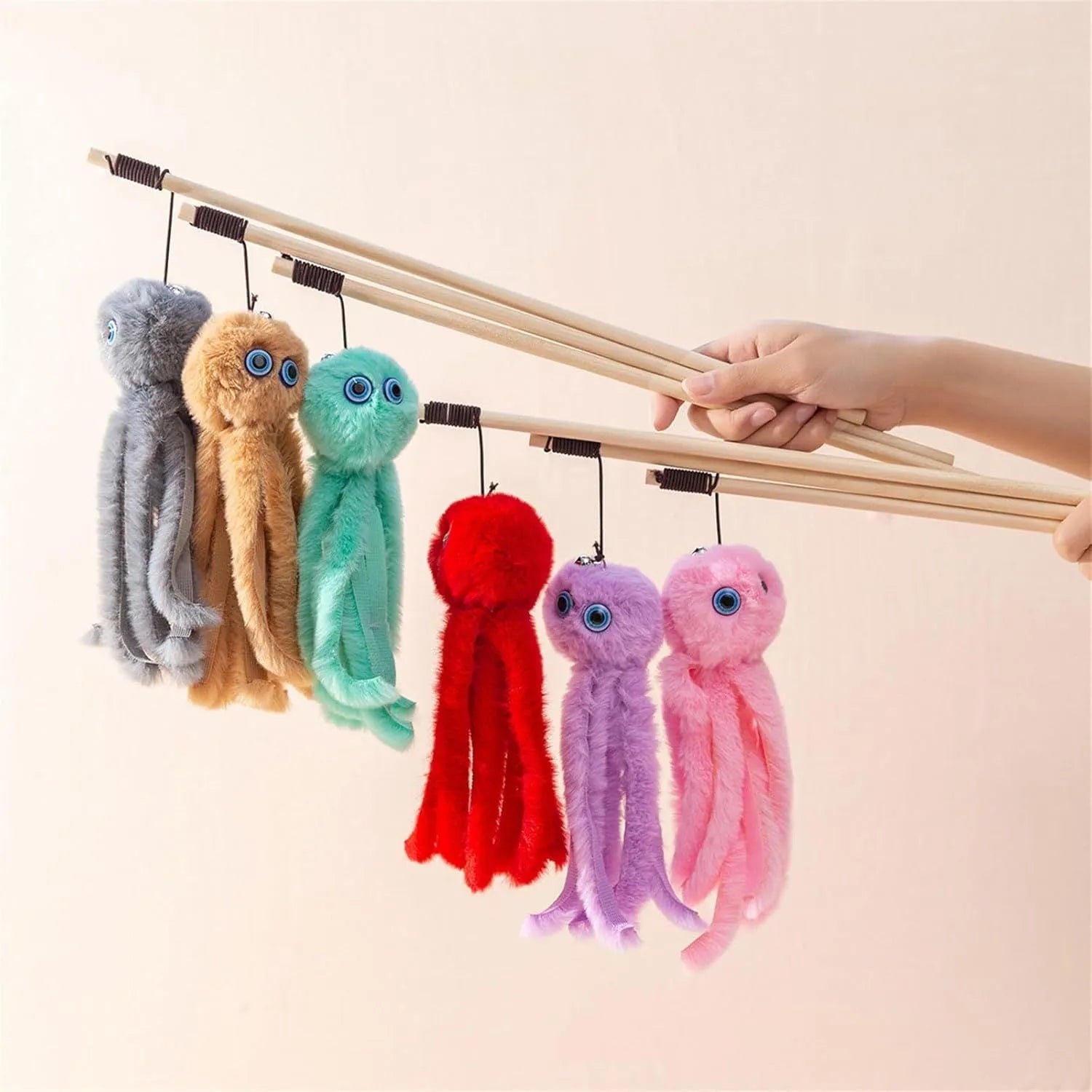 Octopus theme cat toy with long stick handle in bright pink purple red grey colours