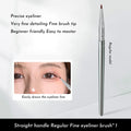 Angle view of a bend head fine tip eyeliner makeup brush for detailed eye application.