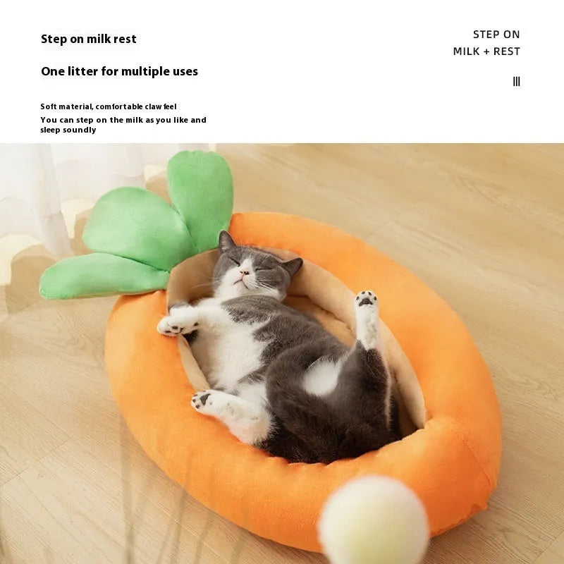 Carrot-shaped orange dog bed with removable washable cover on a floor
