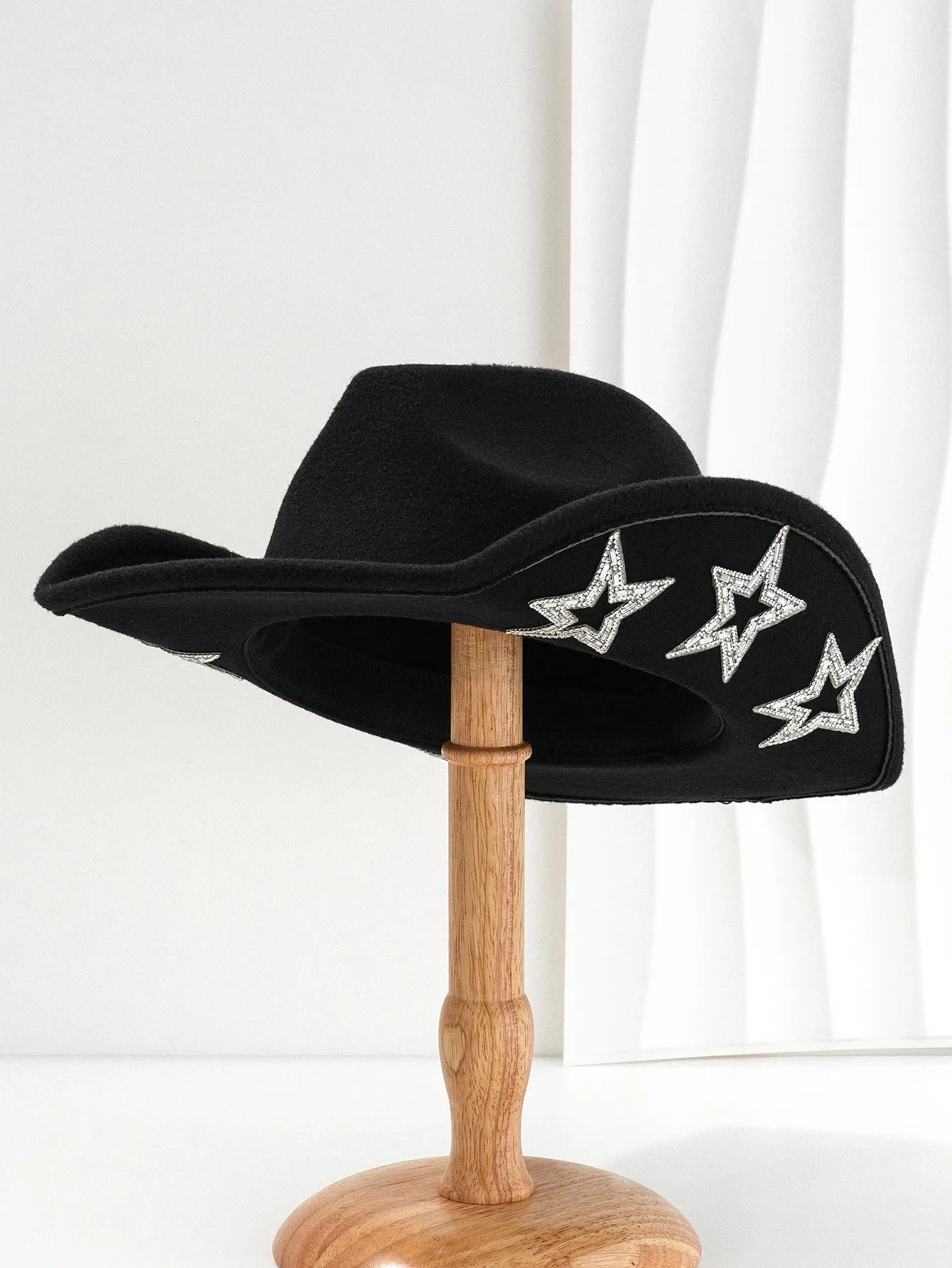 Brown polyester western-style top hat with a conical crown and a silver hexagonal star decoration on the front.