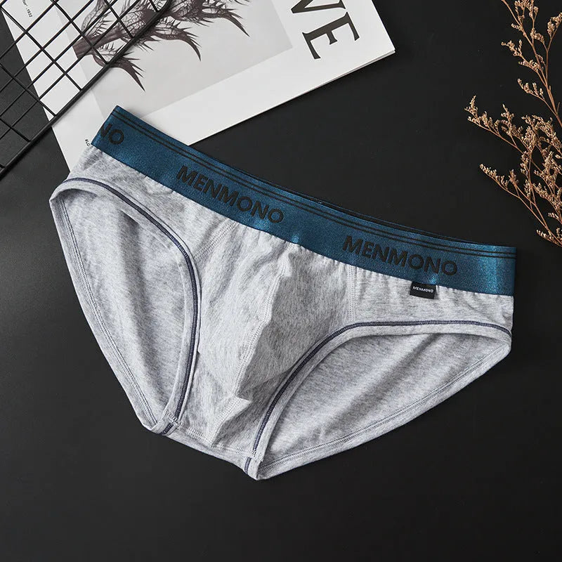 Men's low-waist cotton briefs shown in a two-tone colour combination, such as black with red trim.