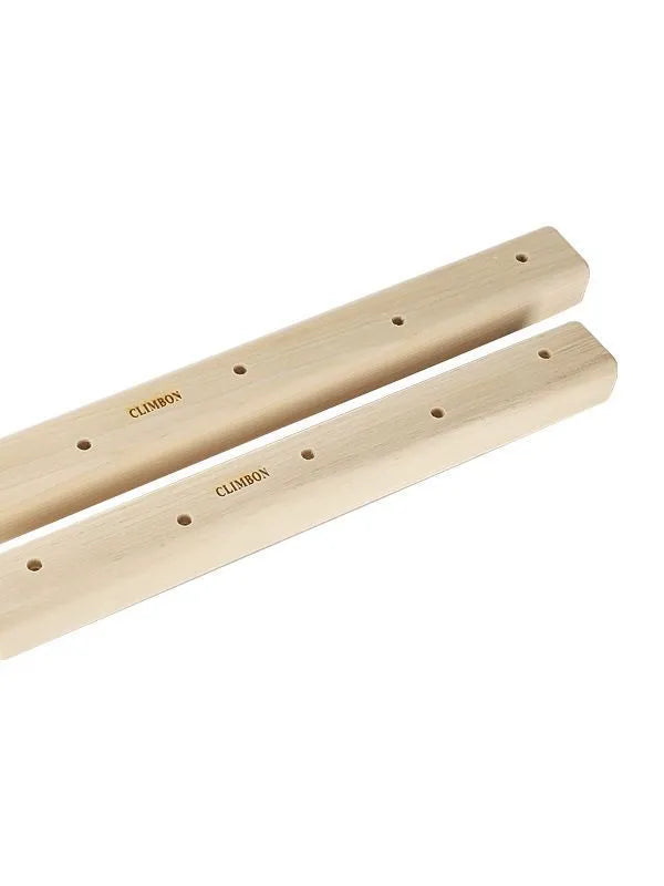 Set of three solid wood grip strength training hangboards in varying thicknesses.
